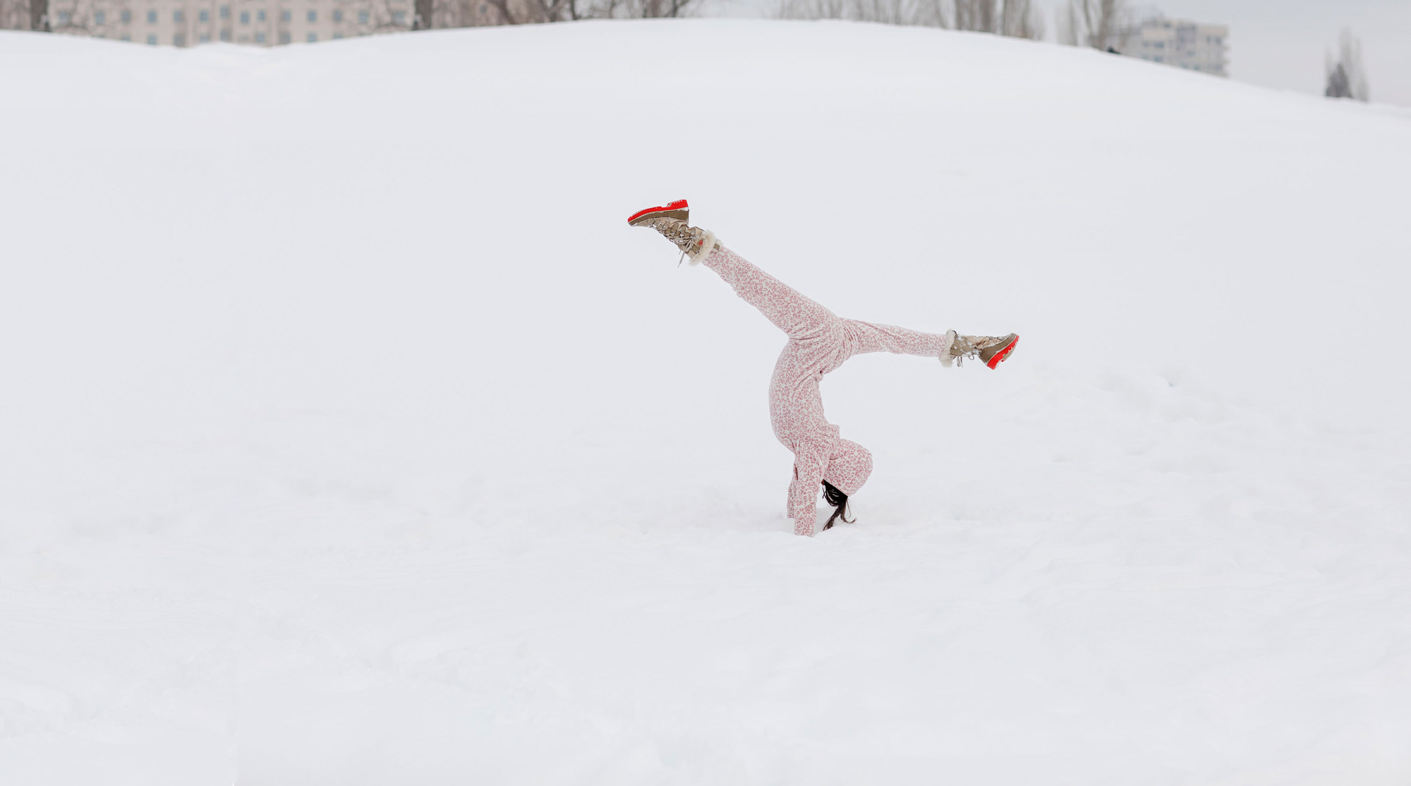cartwheeling on fun snowy day